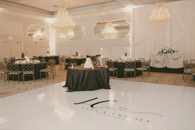 An inviting dance floor at a wedding reception with a custom monogram.